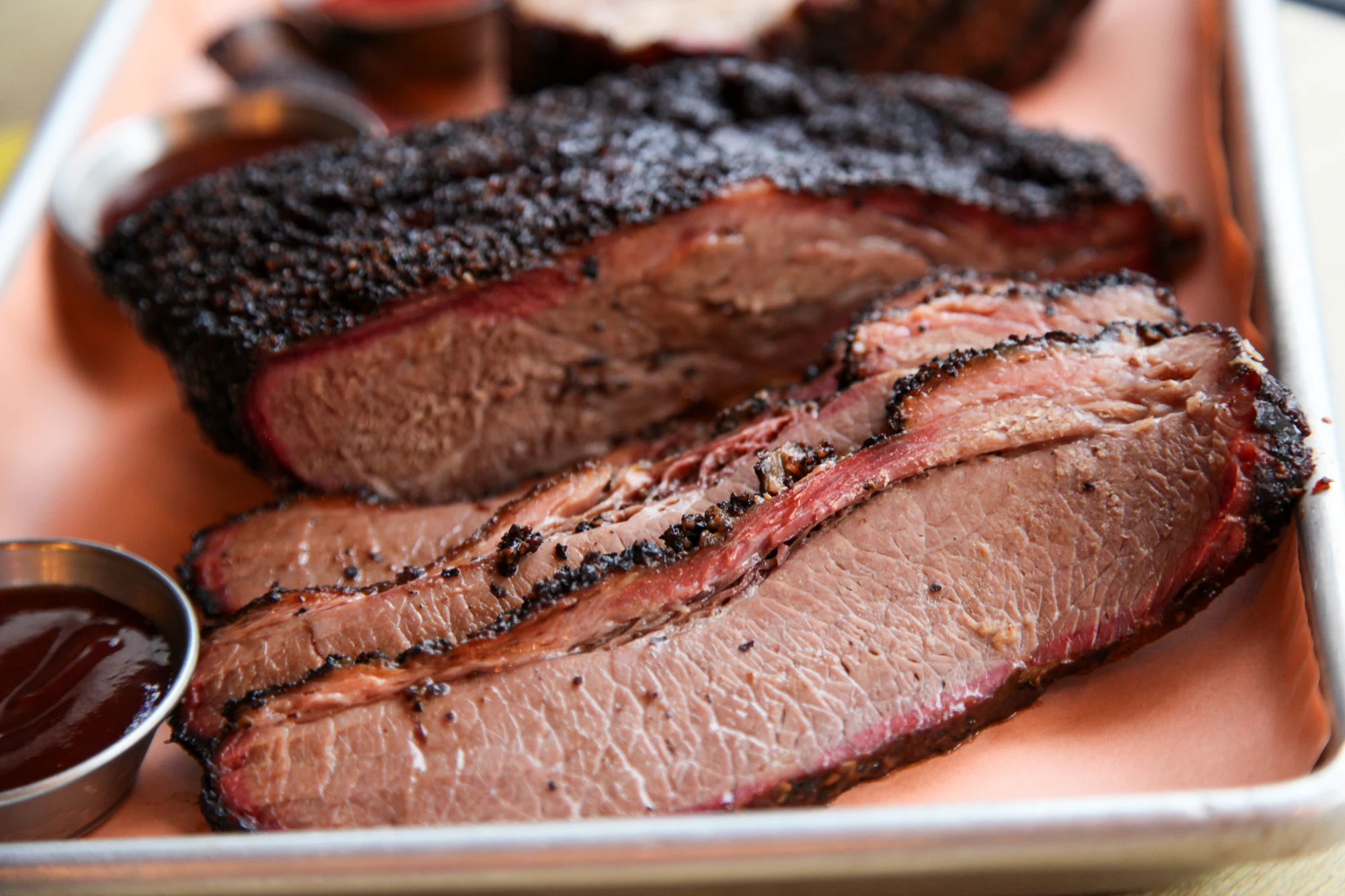 Freshly sliced Texas Joe’s smoked brisket on a tray